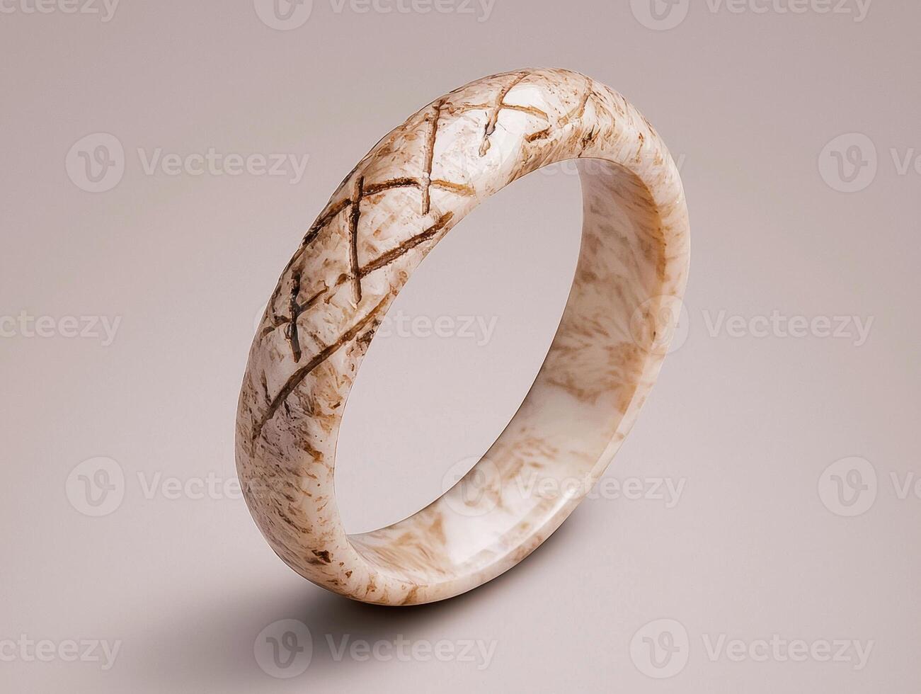 Elegant beige bangle with intricate carvings photo