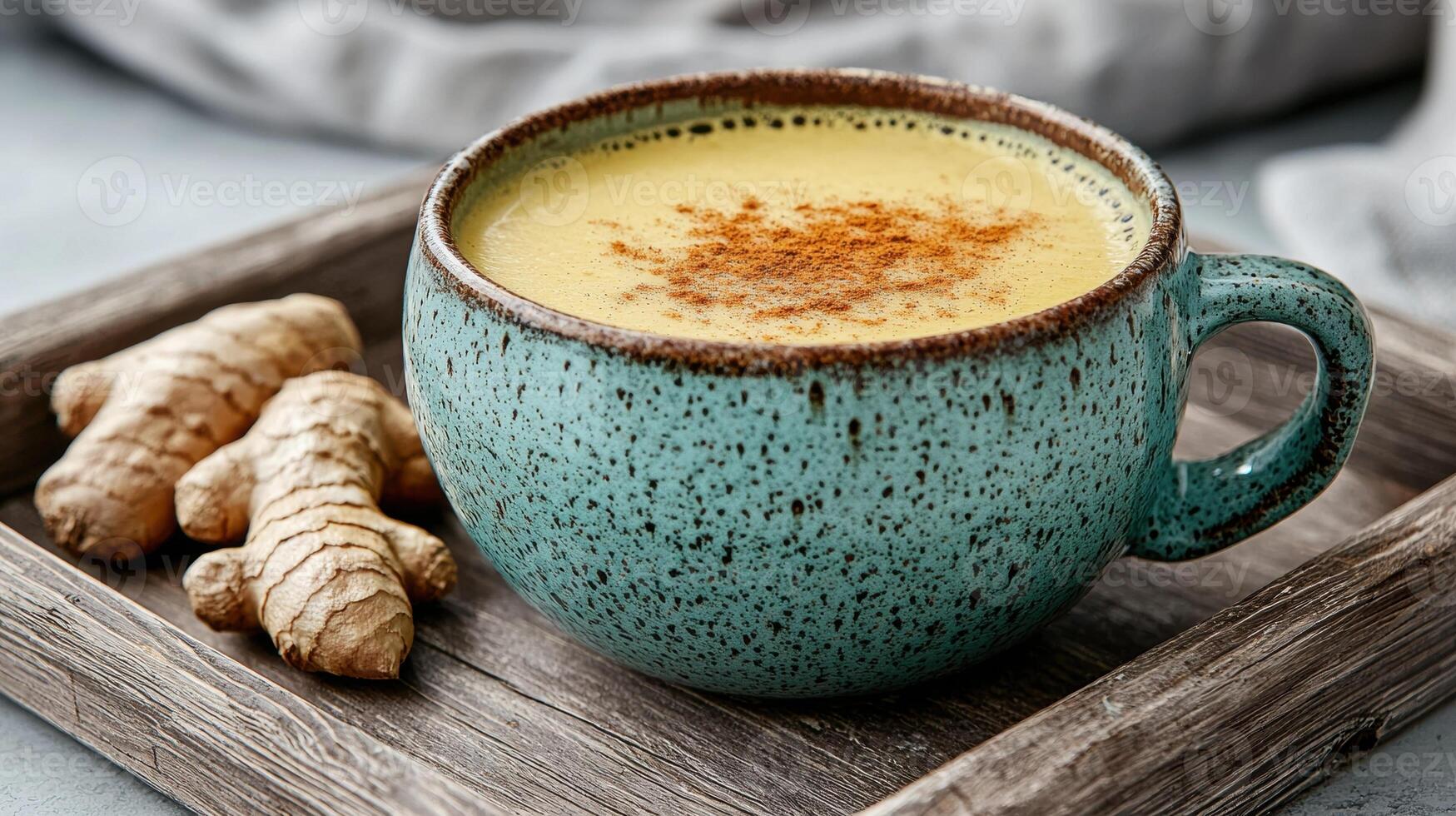 Golden turmeric milk latte in a rustic mug photo
