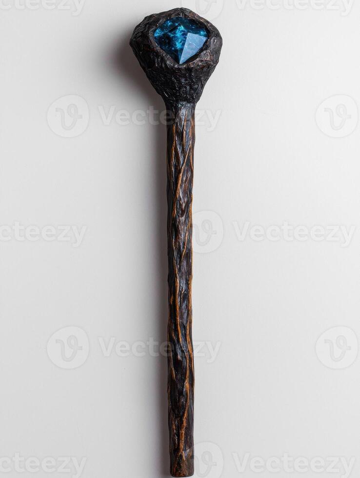 Dark wooden staff with a blue gemstone top photo