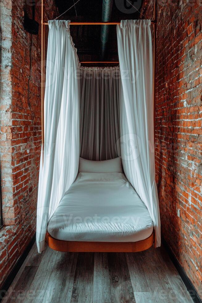 Minimalist bedroom with floating bed and sheer curtains photo