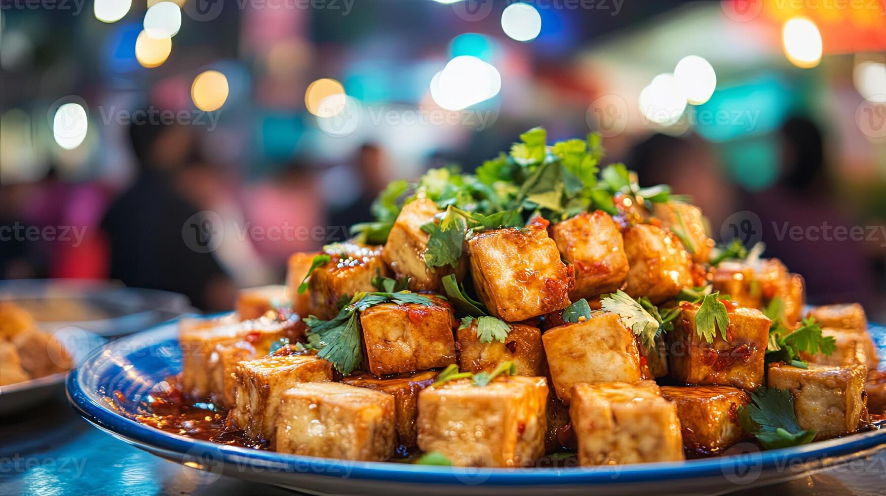 Golden Cubes of Tofu A Culinary Delight at a Night Market photo
