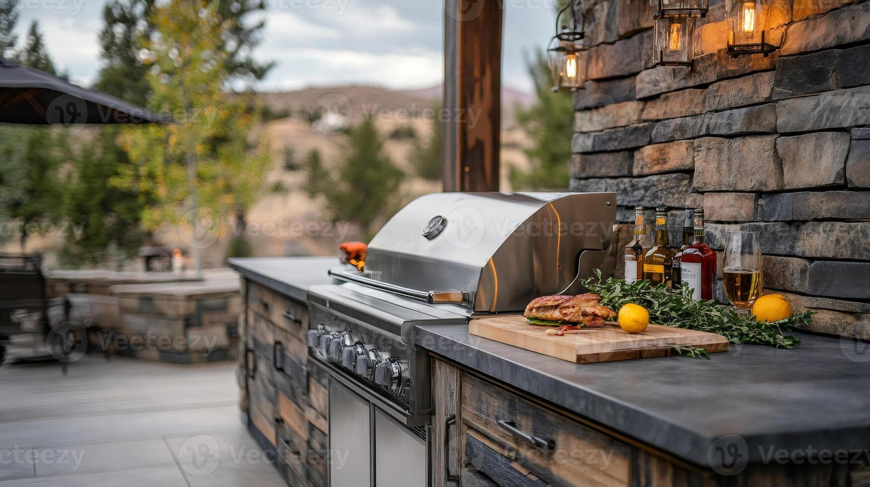 Modern outdoor kitchen featuring stainless steel grill and stone wall photo