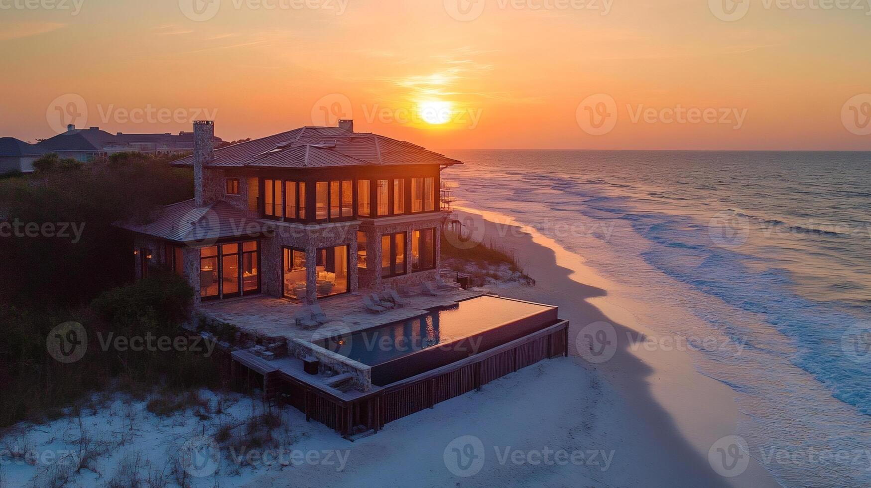 Luxurious beachfront villa setting sun illuminating ocean waves photo