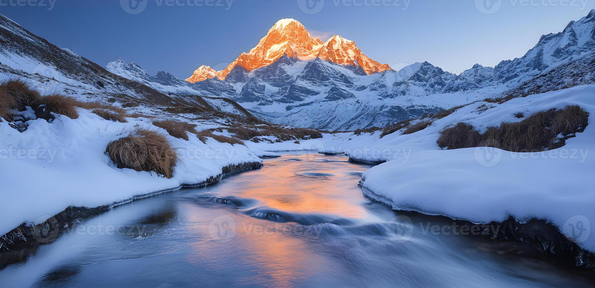 Ama dablam reflecting in the river at sunset, during winter in the himalayas photo