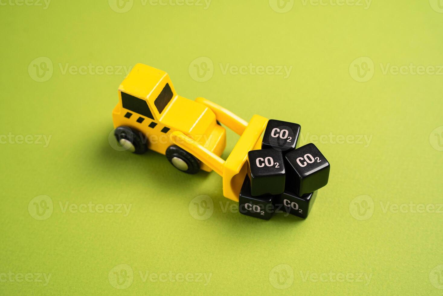 A bulldozer drags cubes of CO2. Greenhouse gas emissions from industry. New rules and directives, restrictions on the impact on the environment. Carbon taxes. Closed waste-free production cycle. photo