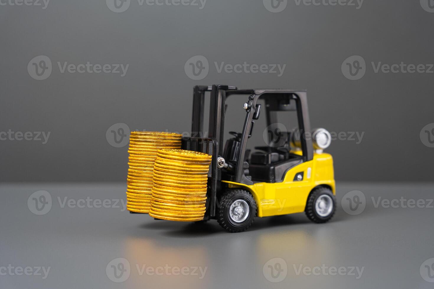 Forklift and stacks of coins. Increase income in export of goods. Trade traffic increasing. Production rise. Growing transportation prices. Growth in profits. High shipping rates. photo