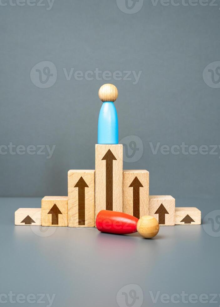 The man defeated his opponent. Toppling the opponent from the top. To take the place of the rival. Pinnacle of success. Competition and strategic maneuvering required to secure a leading position photo