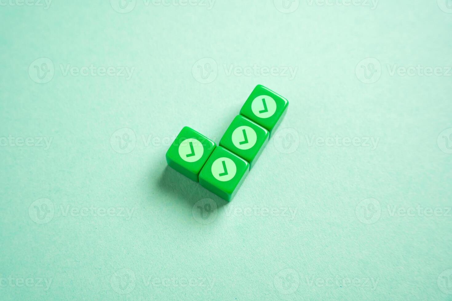 Green checkmark made of blocks with small checkmarks. Divide the work into parts for its easy execution. Concept of planning and dividing the work. photo