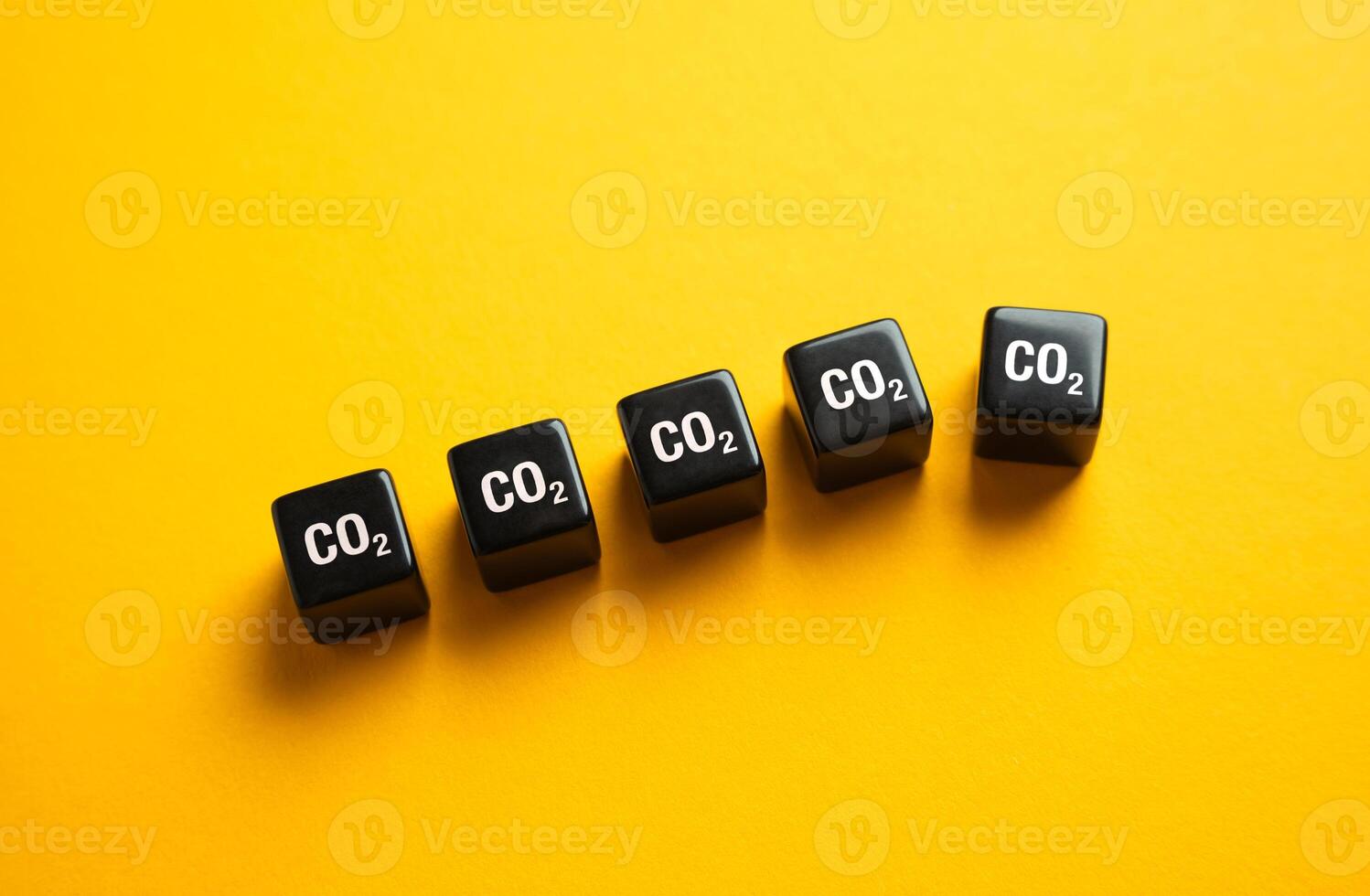 Blocks of cubic meters of CO2 one of which falls out. The concept of reducing greenhouse gas emissions and carbon dioxide. Improving the environmental situation. Tightening regulatory laws. photo