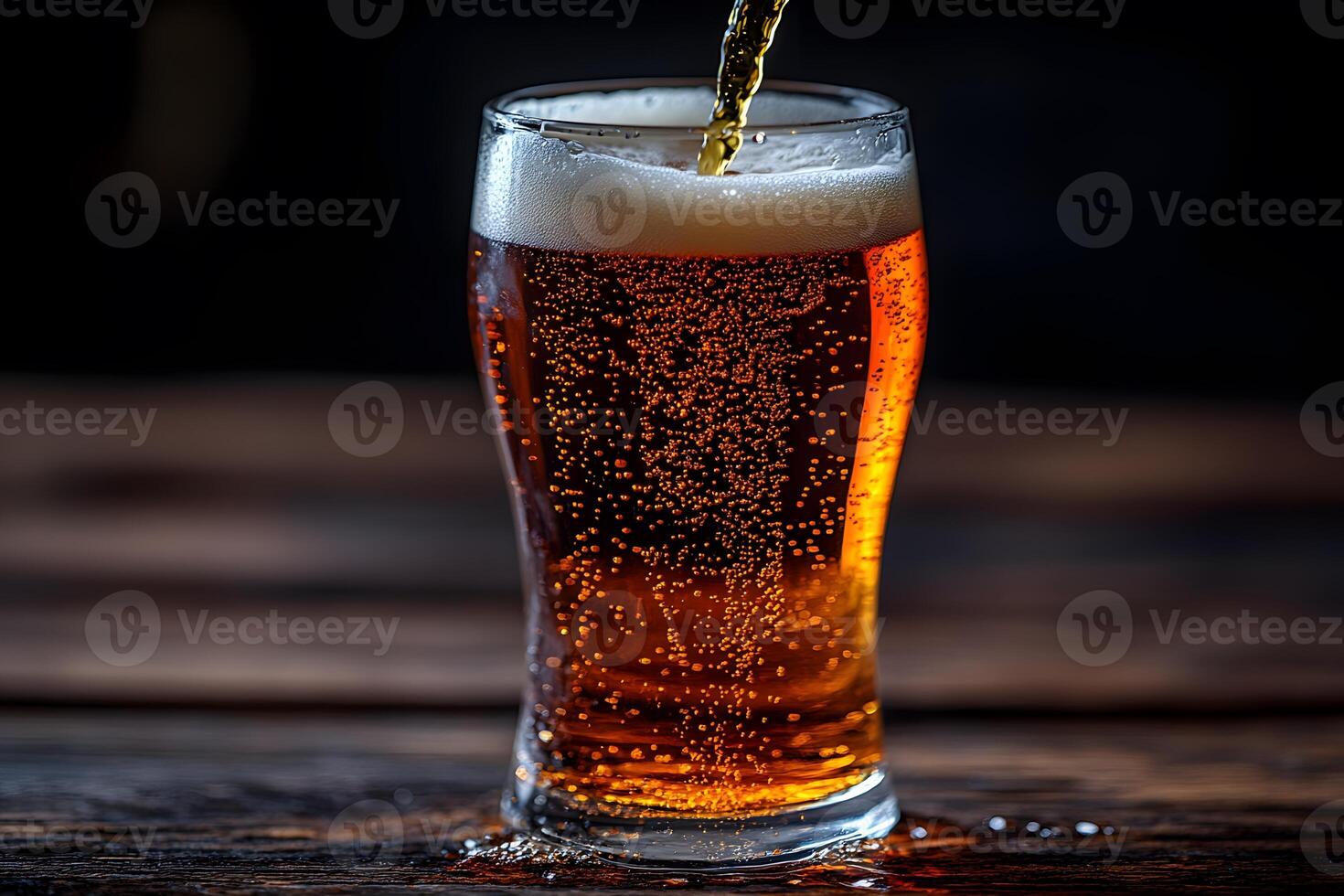 Refreshing Pour of Craft Beer in a Tall Glass on Rustic Wooden Table photo