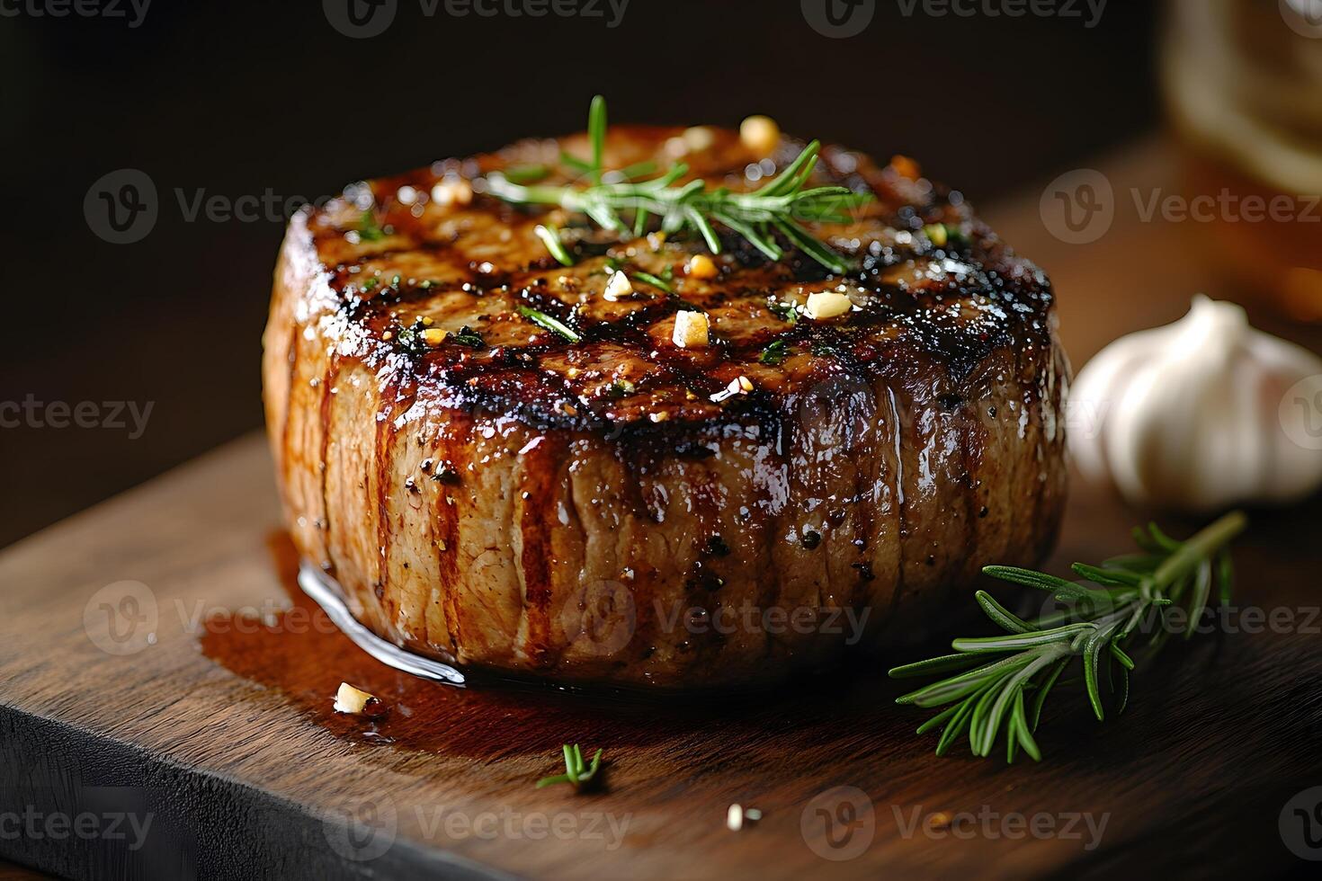 Gourmet Grilled Filet Mignon with Fresh Rosemary on Wooden Board photo