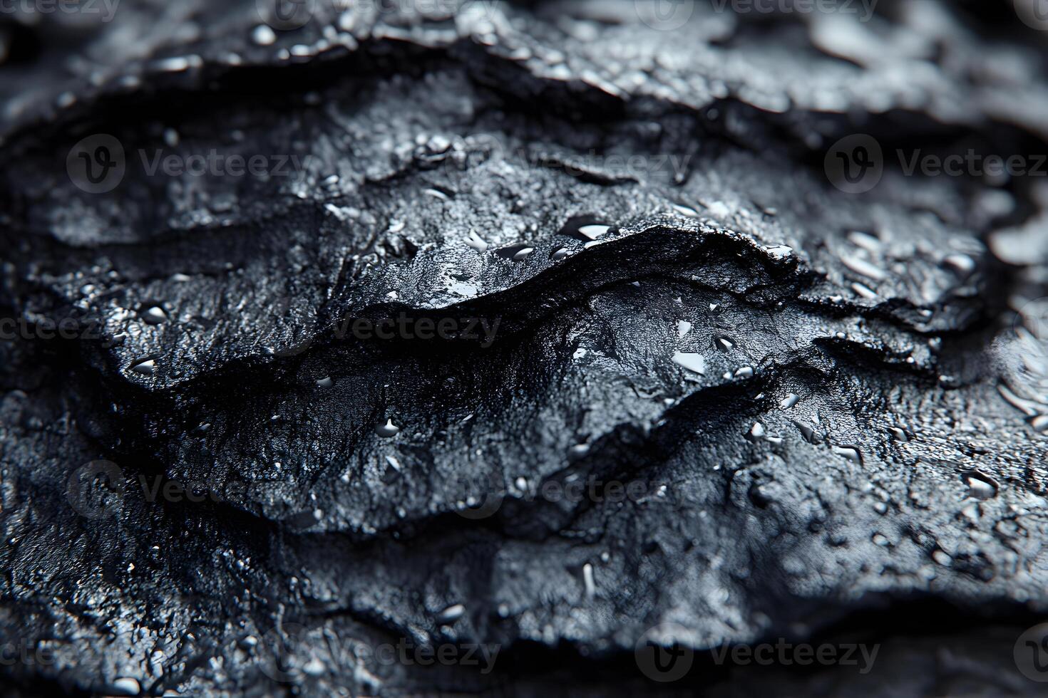Abstract Texture of Black Rock Surface with Water Droplets for Artistic Backgrounds photo