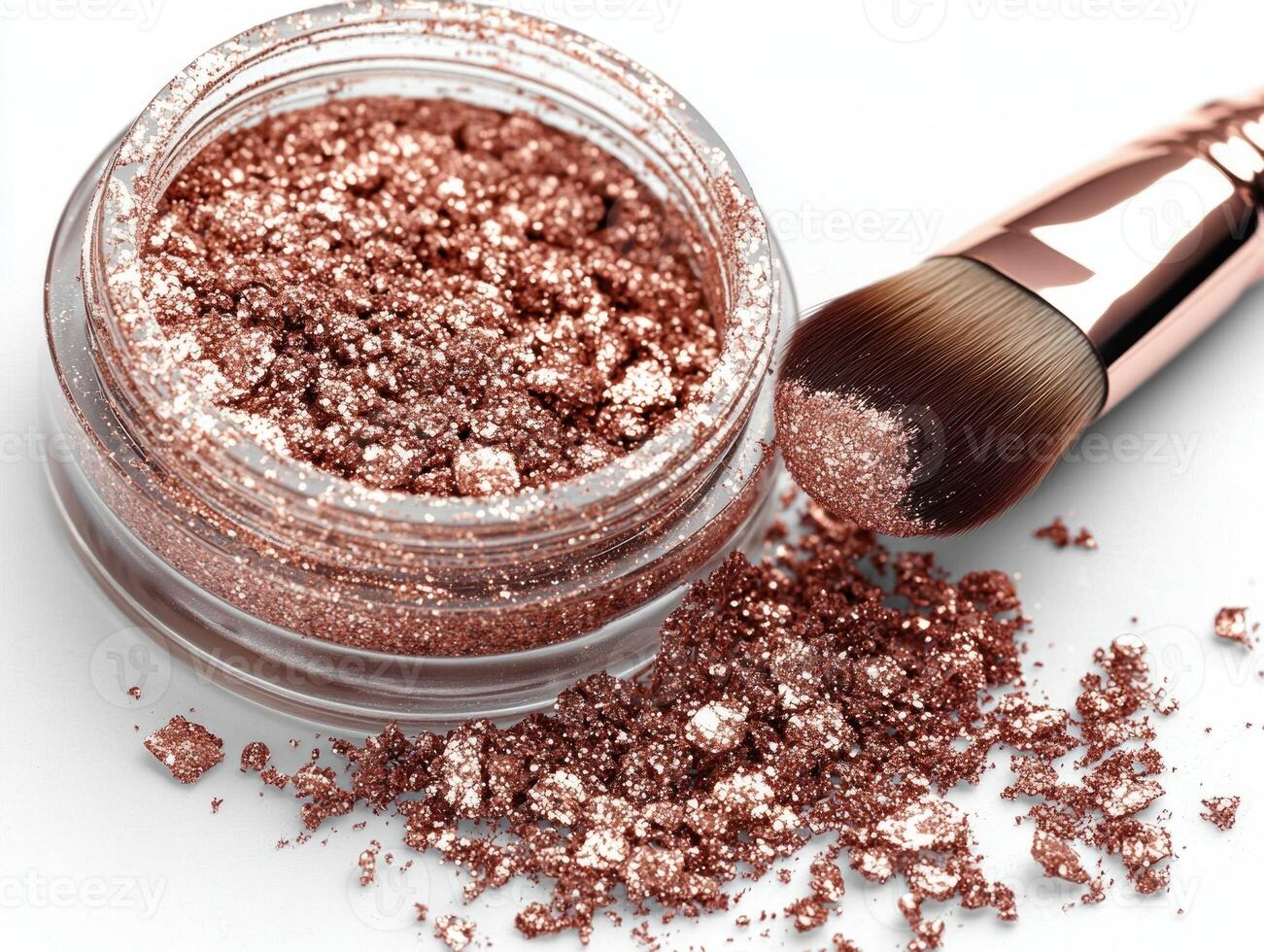 jar filled shimmering rose gold eyeshadow pigment showcases its beauty as soft brush dips into powder spilling some onto pristine white surface beneath photo