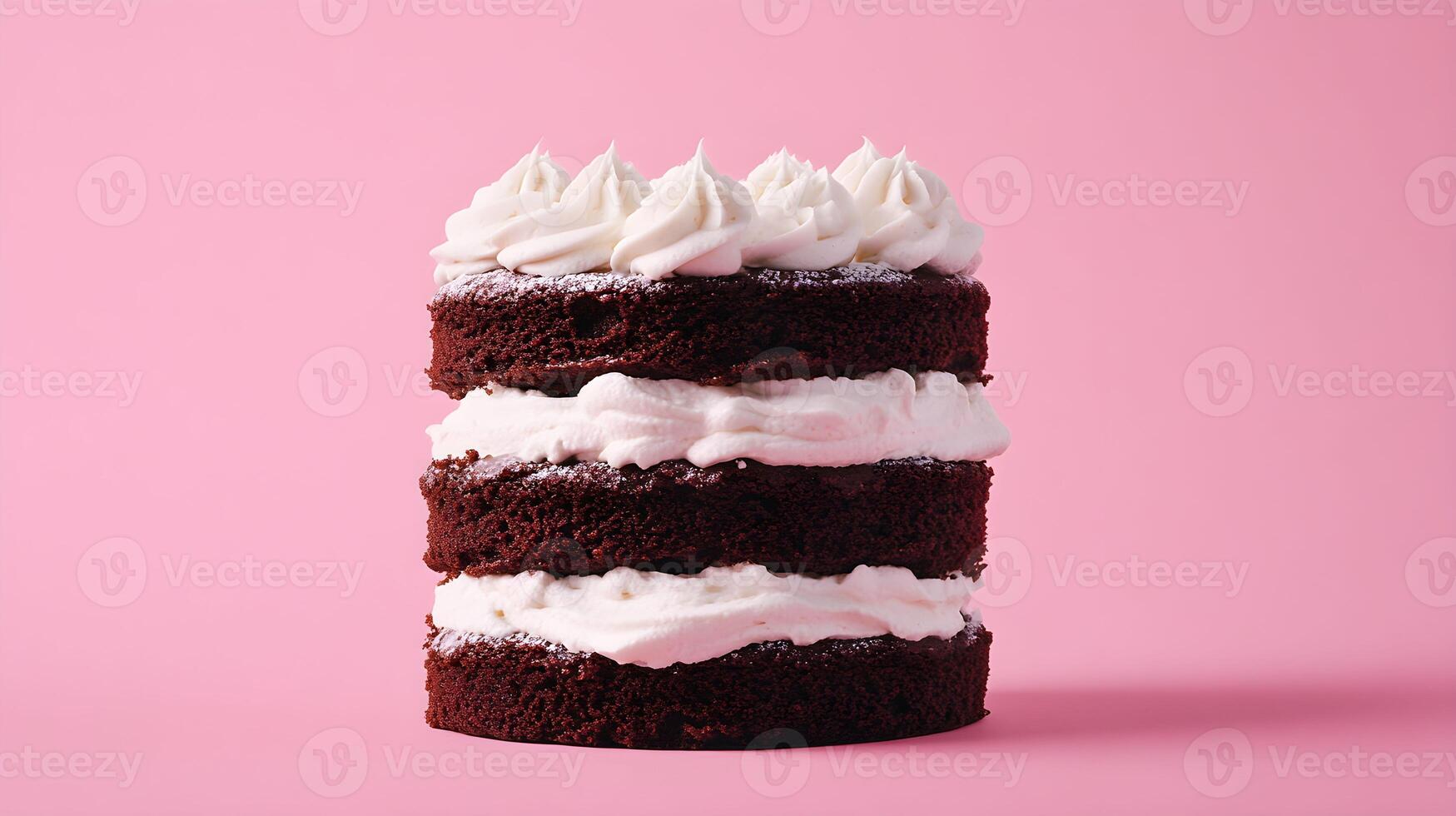 A stack of three chocolate cake layers on a pink background photo