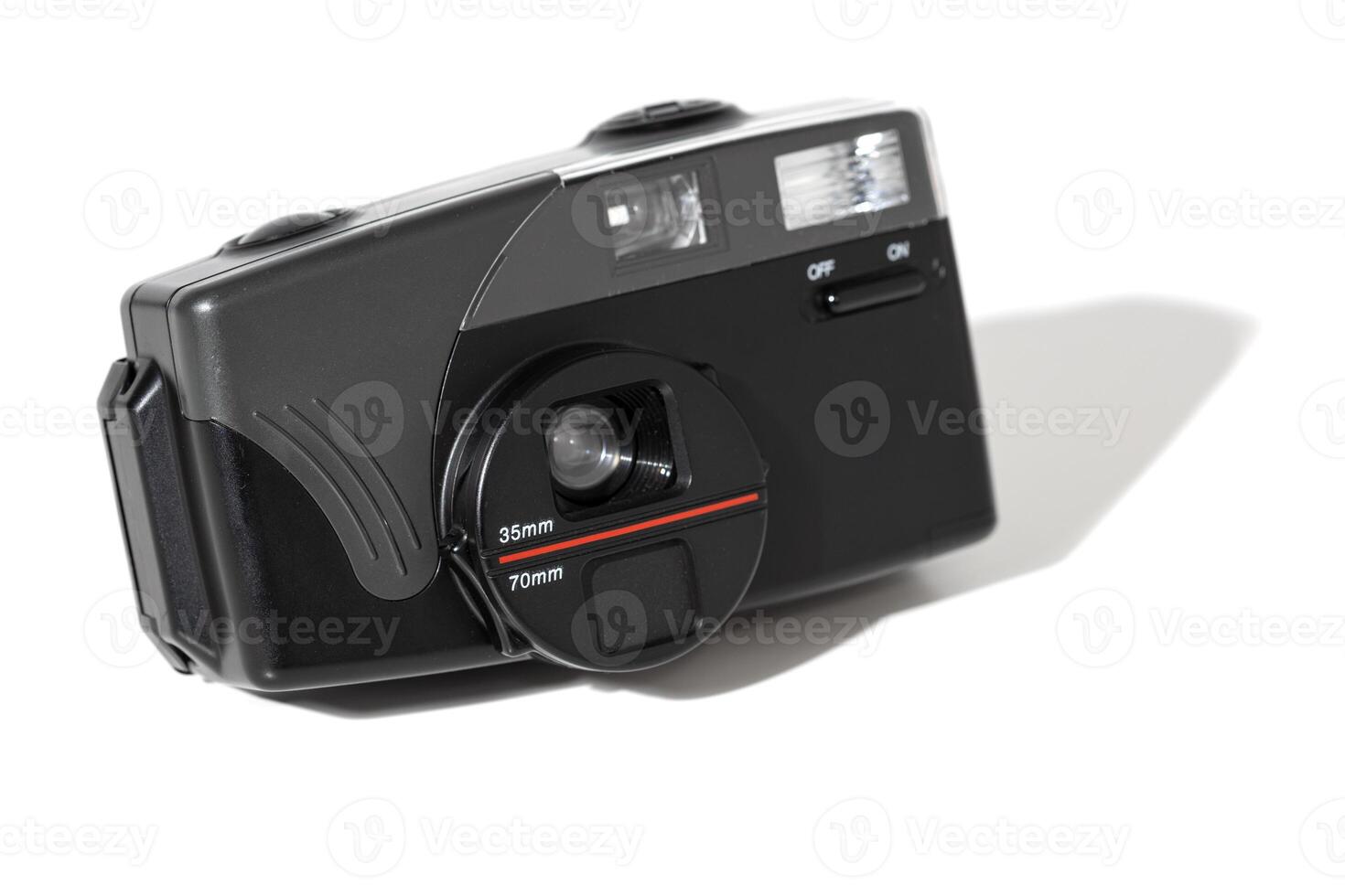 Vintage compact film camera isolated on white background photo