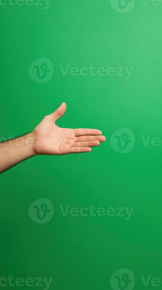 Hand Gesturing on Vibrant Green Screen Background for Magic Trick or Graphic Design Concept and Creative Presentations photo