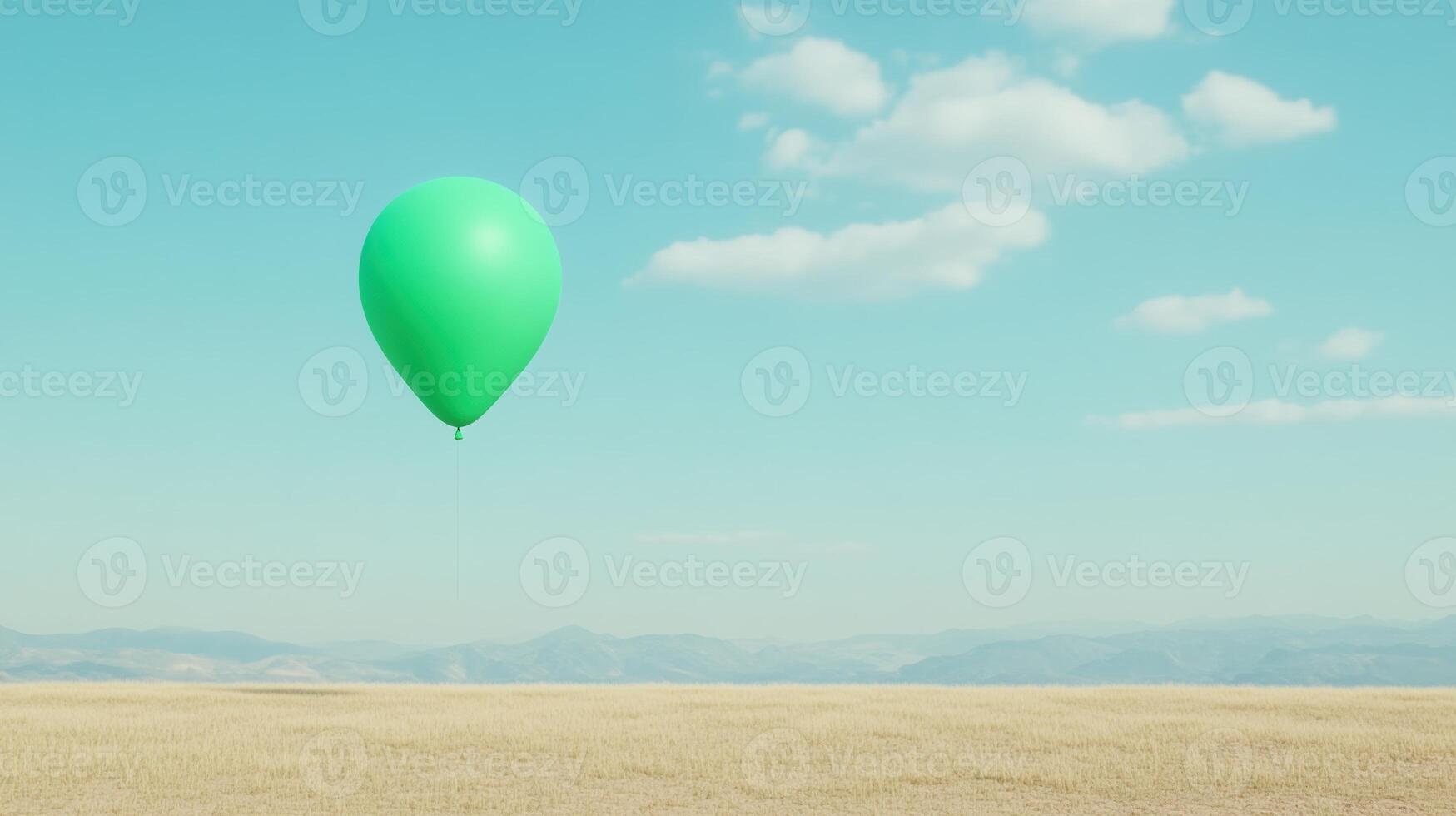 Green Balloon Floating in Clear Blue Sky Above Peaceful Meadow with White Clouds and Distant Mountain View, Capturing Tranquility and Beauty at High Altitude in a Serene Natural Landscape photo