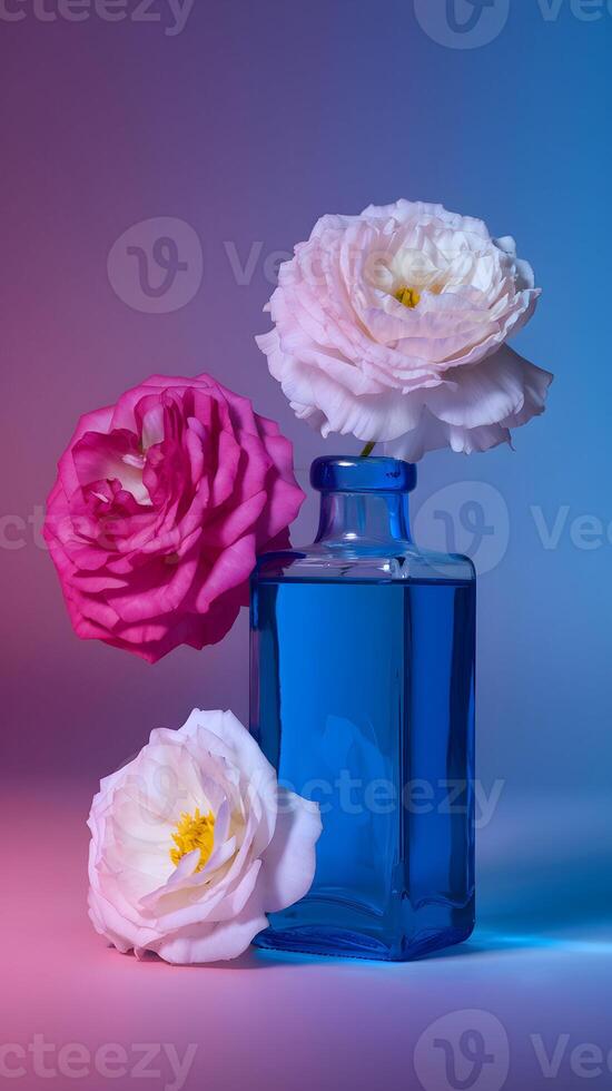 Rectangular glass bottle with blue liquid, surrounded by vibrant flowers on gradient background. Vertical Mobile Wallpaper photo