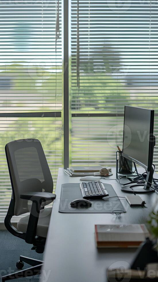 Office Desk Window side desk with computer, stationery, and serene outdoor greenery Vertical Mobile Wallpaper photo