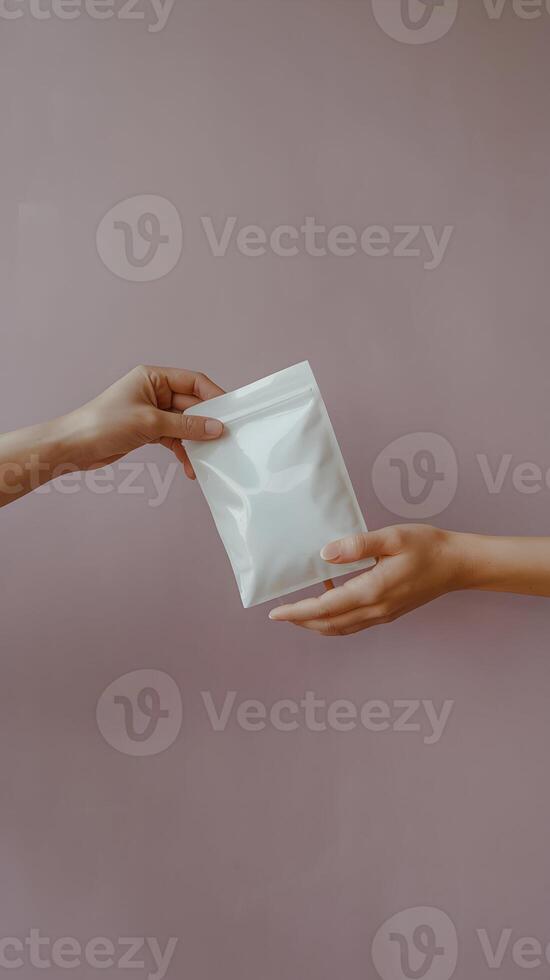 Hands exchanging a rectangular white pouch, minimalist composition of transfer gesture Vertical Mobile Wallpaper photo