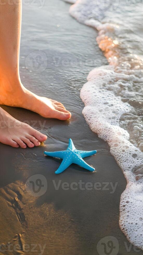 Bare feet on wet sand, starfish beside ocean waves, golden sunlight glow Vertical Mobile Wallpaper photo