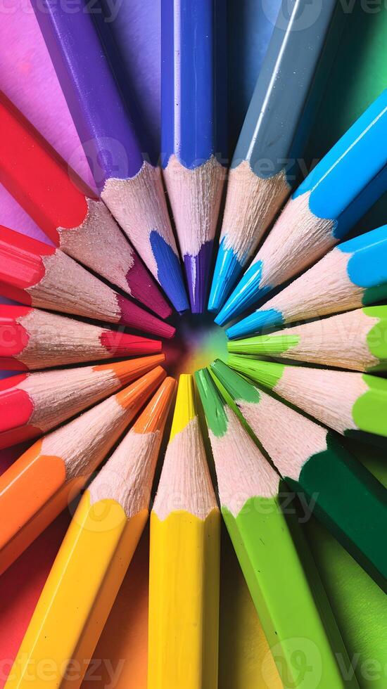 Sharply pointed colored pencils in a vibrant gradient, enhancing artistic presentation Vertical Mobile Wallpaper photo