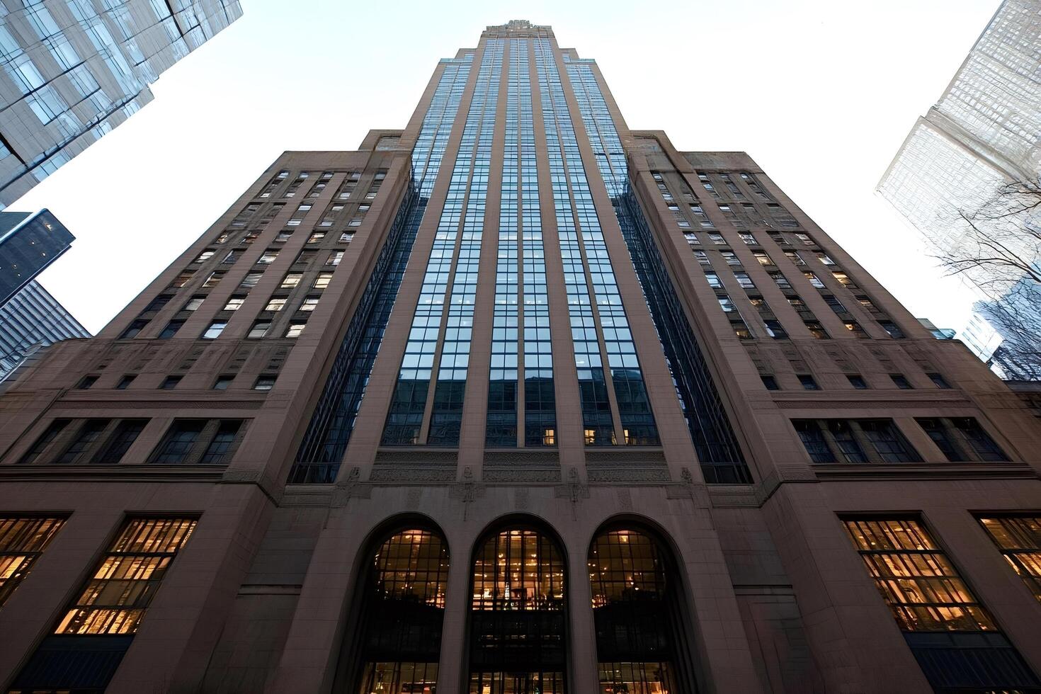 Majestic skyscraper reaching for the sky in urban center photo