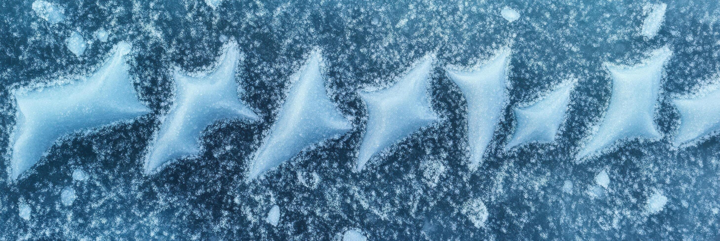 Abstract pattern of ice formations on a frozen surface in cold winter environment photo