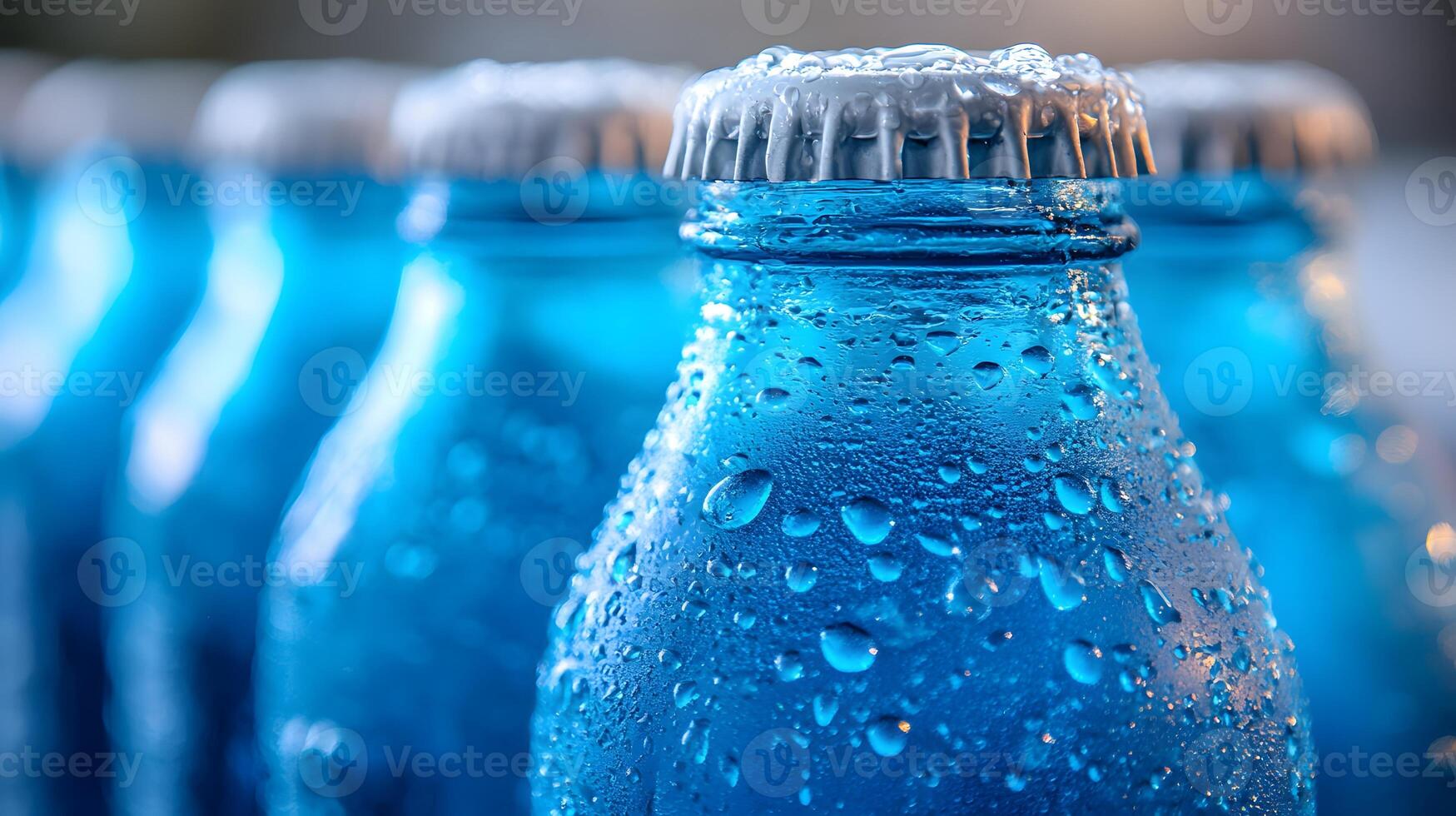 Blue glass soda bottles line up perfectly, displaying carbonated beverages with condensation drops, creating refreshing summer vibes against soft bokeh background. condensation photo