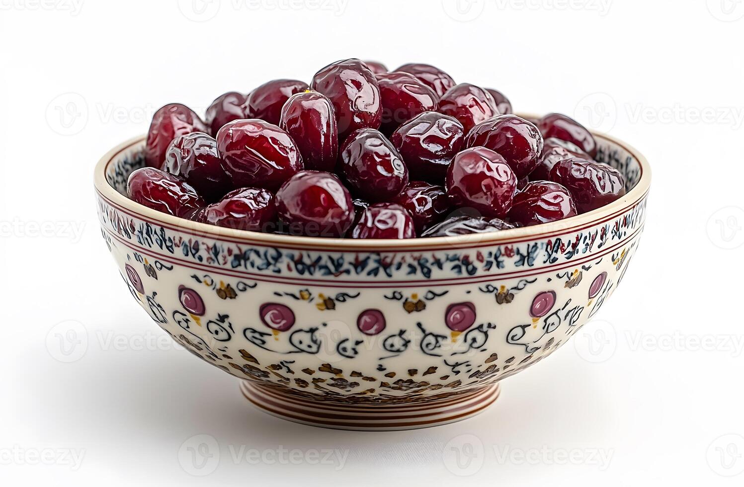 A bowl of red dates in a decorative bowl photo