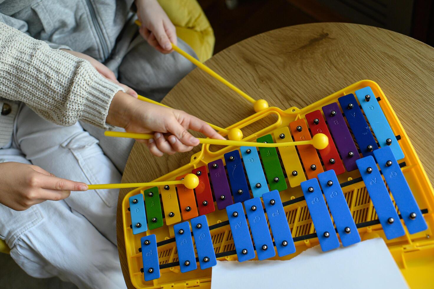 Two children create joyful sounds on their xylophones. photo
