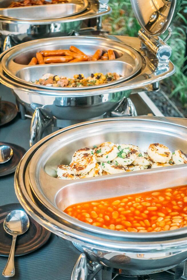 Buffet with food and silver trays photo