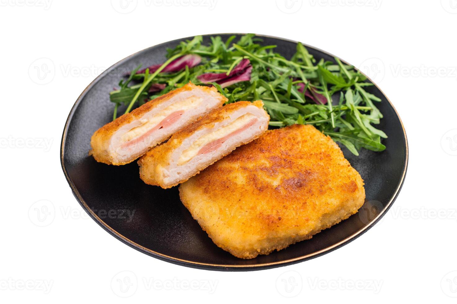 Chicken cordon bleu cutlet with cheese and ham on plate with salad isolated on white backgroun photo