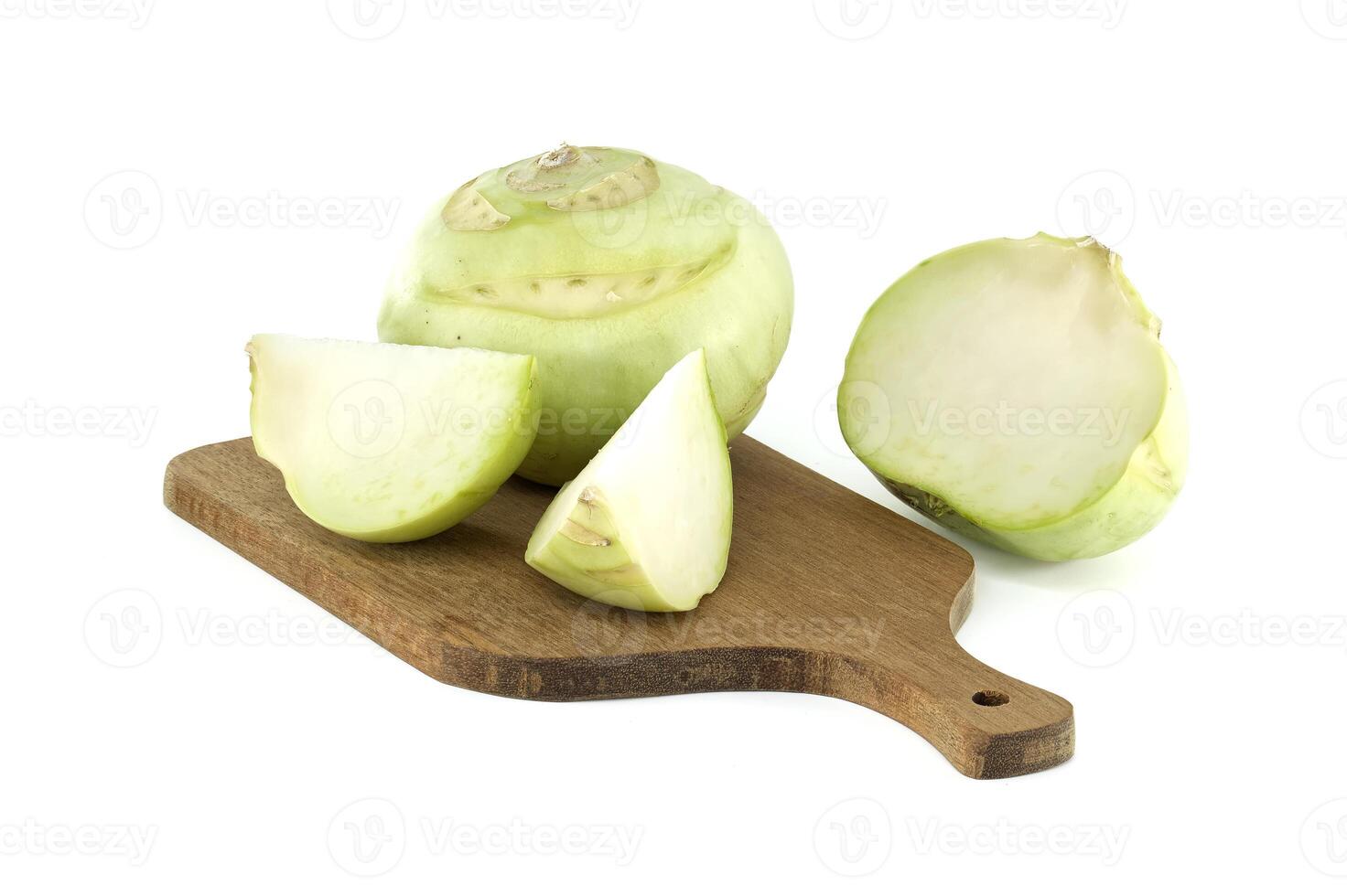 Fresh Kohlrabi Cut and Whole on Wooden Chopping Board Isolated on White photo