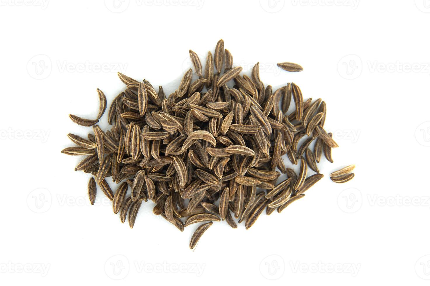 Pile of caraway seeds creating a culinary composition on white background photo