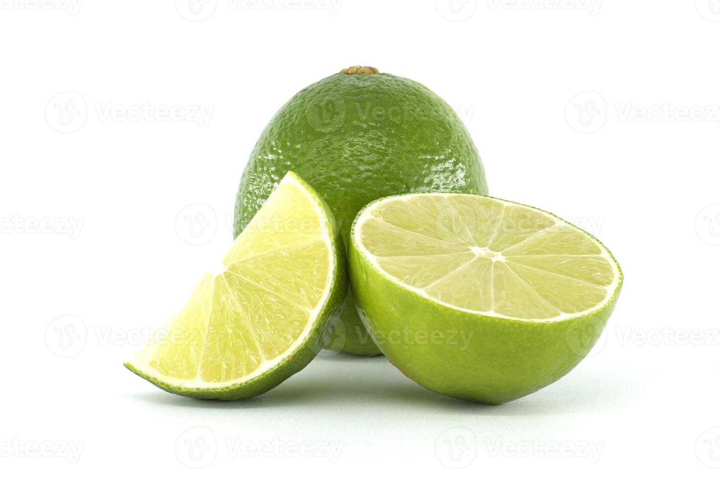 Fresh lime fruits, whole, half and slice, isolated on white background photo