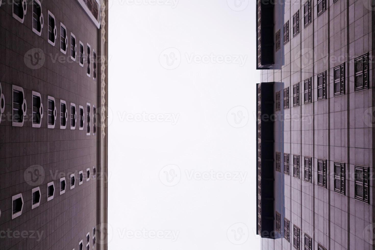 View from below between two tall buildings photo