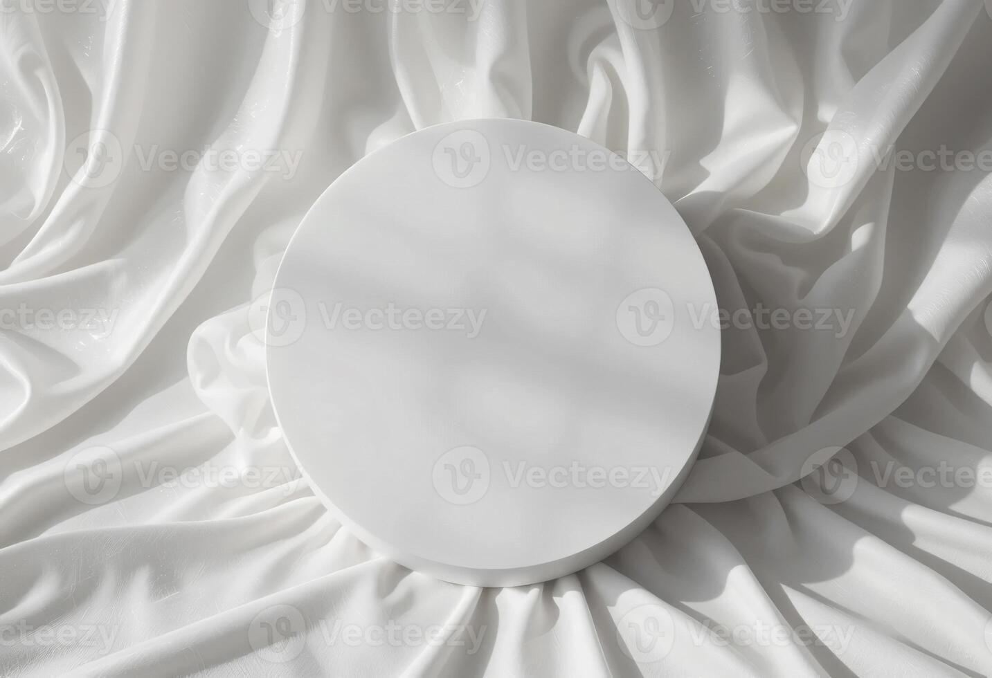 Top view of round white podium stand for cosmetics product presentation on smooth elegant white cloth fabric background photo