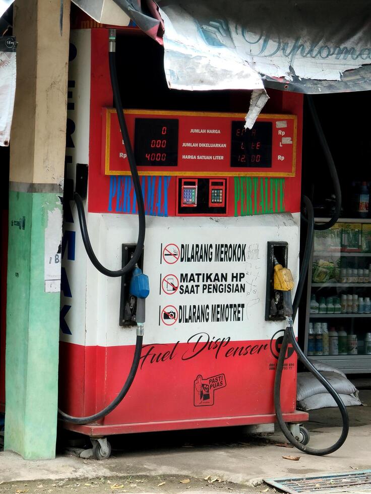 Demak, Indonesia December 17 2024, Fuel pump station in village. energy business. photo