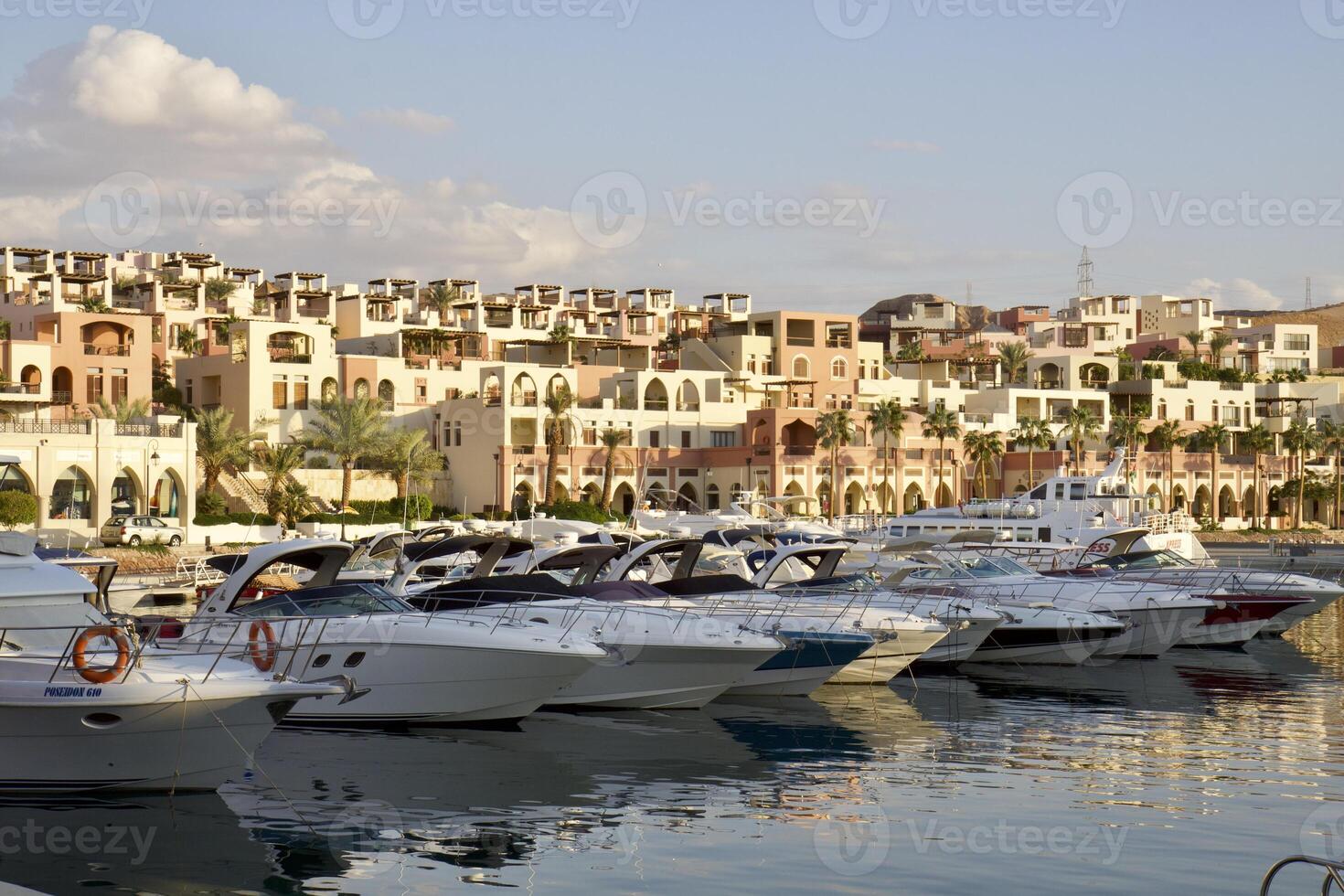Yachts at the pier in the rays of sunset in Aqaba, Jordan. photo