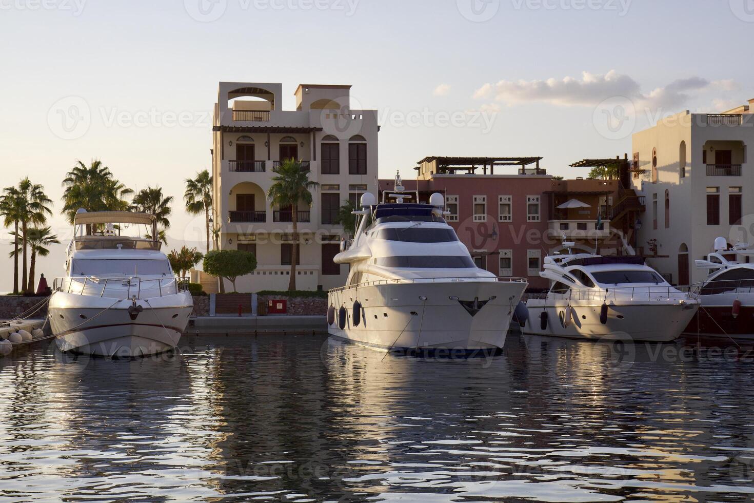 Yachts at the pier in the rays of sunset in Aqaba, Jordan. photo