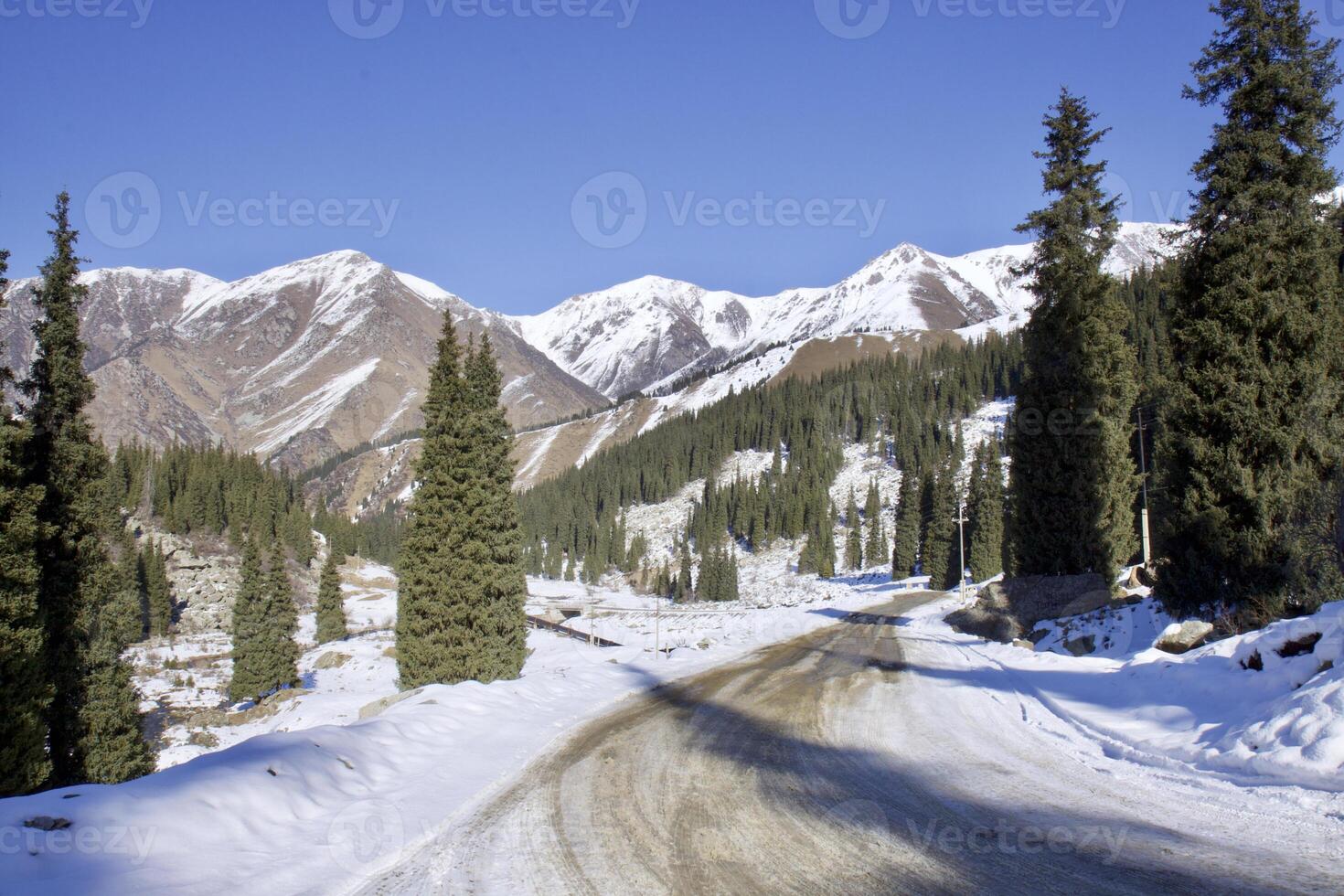 Winter mountain lake surrounded by a mountain rage photo