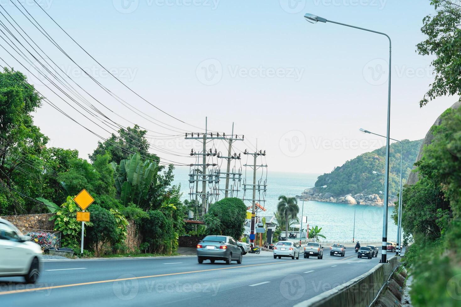 Driving on the beach road around the island in summer Sea view on the way to summer vacation photo
