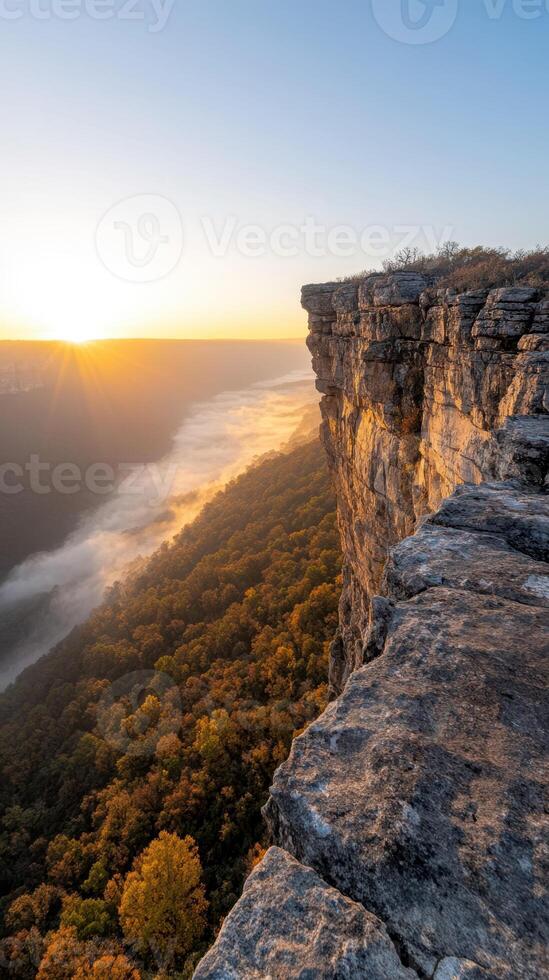 Stunning sunrise over mountain ridge with mist below photo