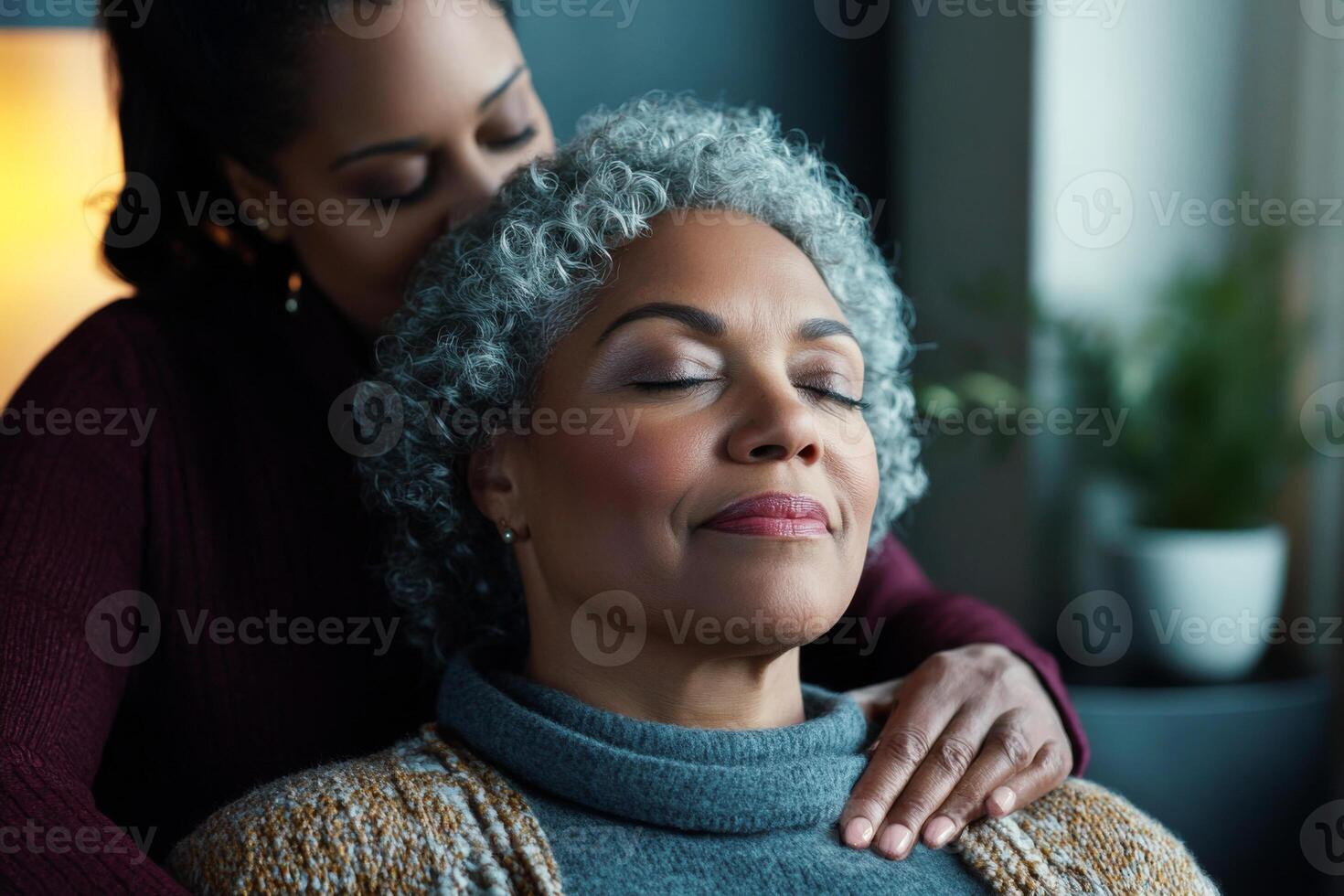 Senior woman closes her eyes while enjoying relaxing massage in spa photo