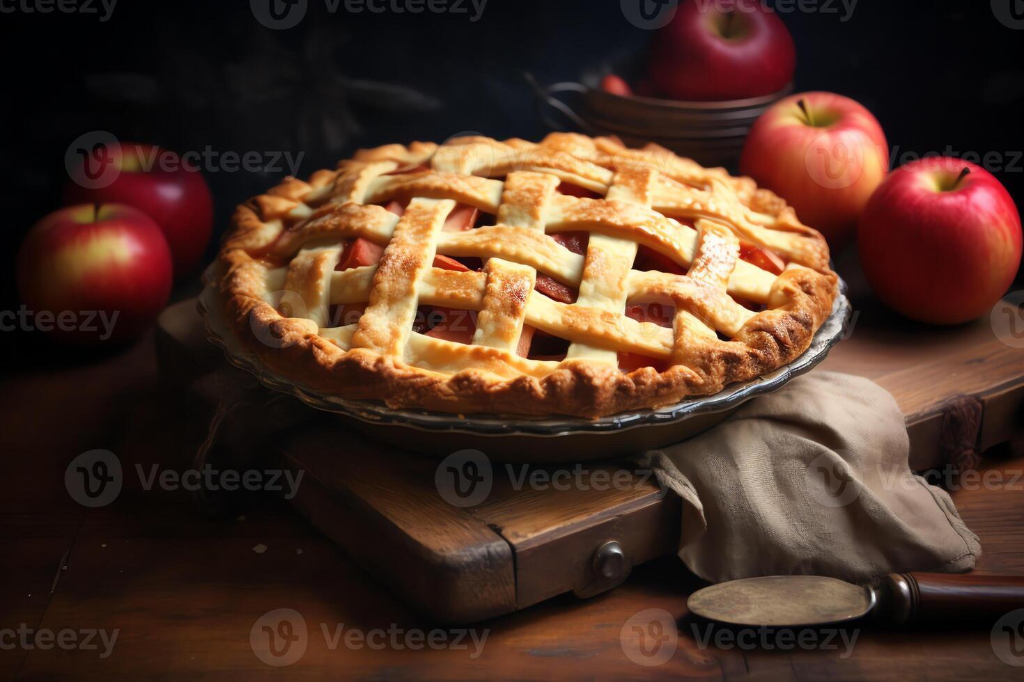 A pie with lattice on top of a wooden table photo