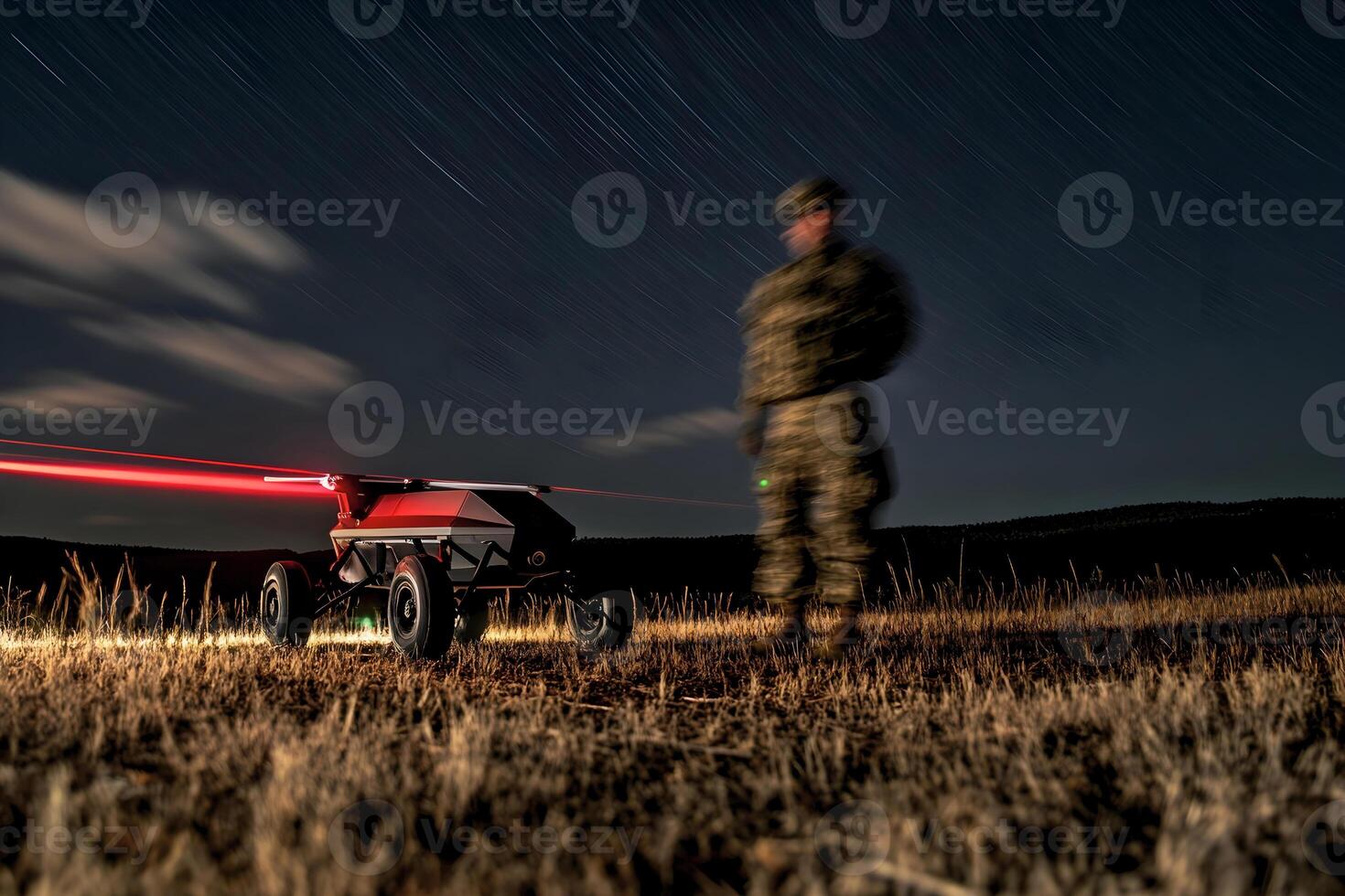 Ground based military drone operates at night in remote terrain. photo