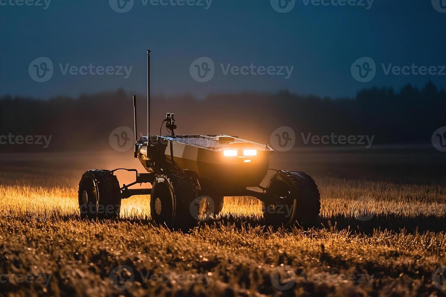 Ground based military drone operates in a field under evening light. photo