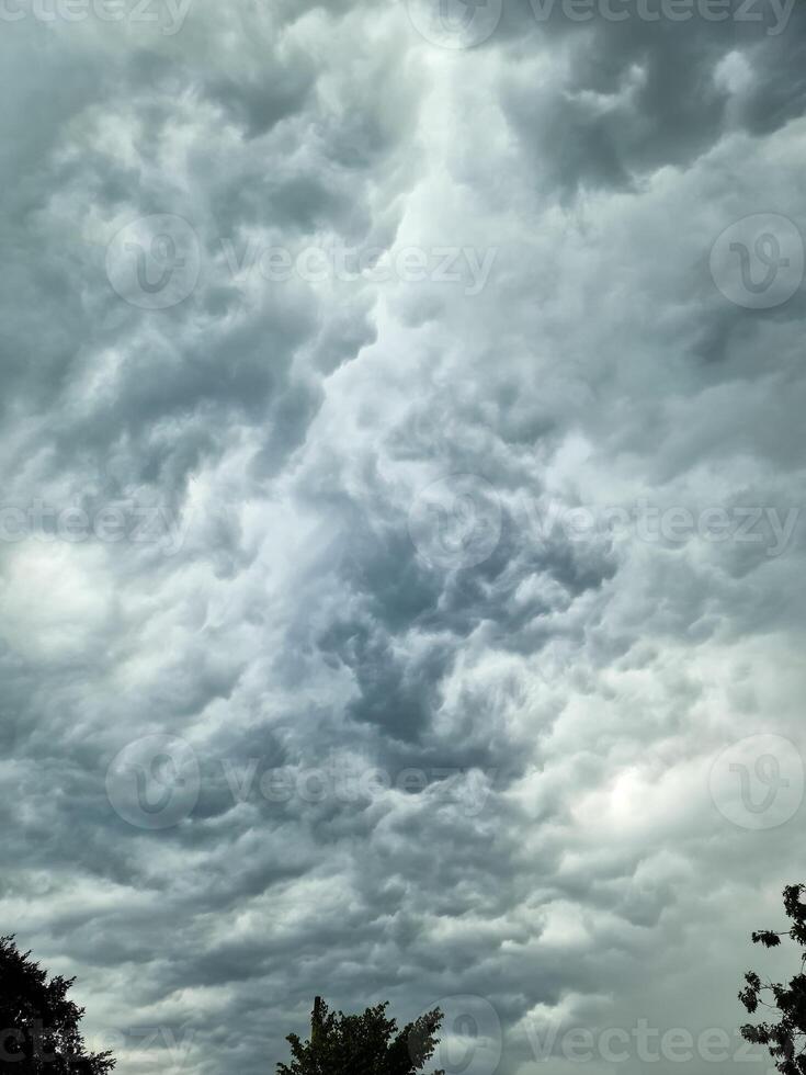 Looming storm clouds create a dramatic prelude to the thunderstorm ahead. photo
