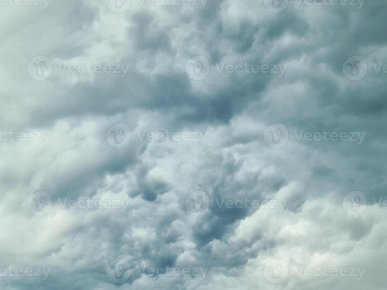The heavens darken as a mass of storm clouds builds before a thunderstorm. photo